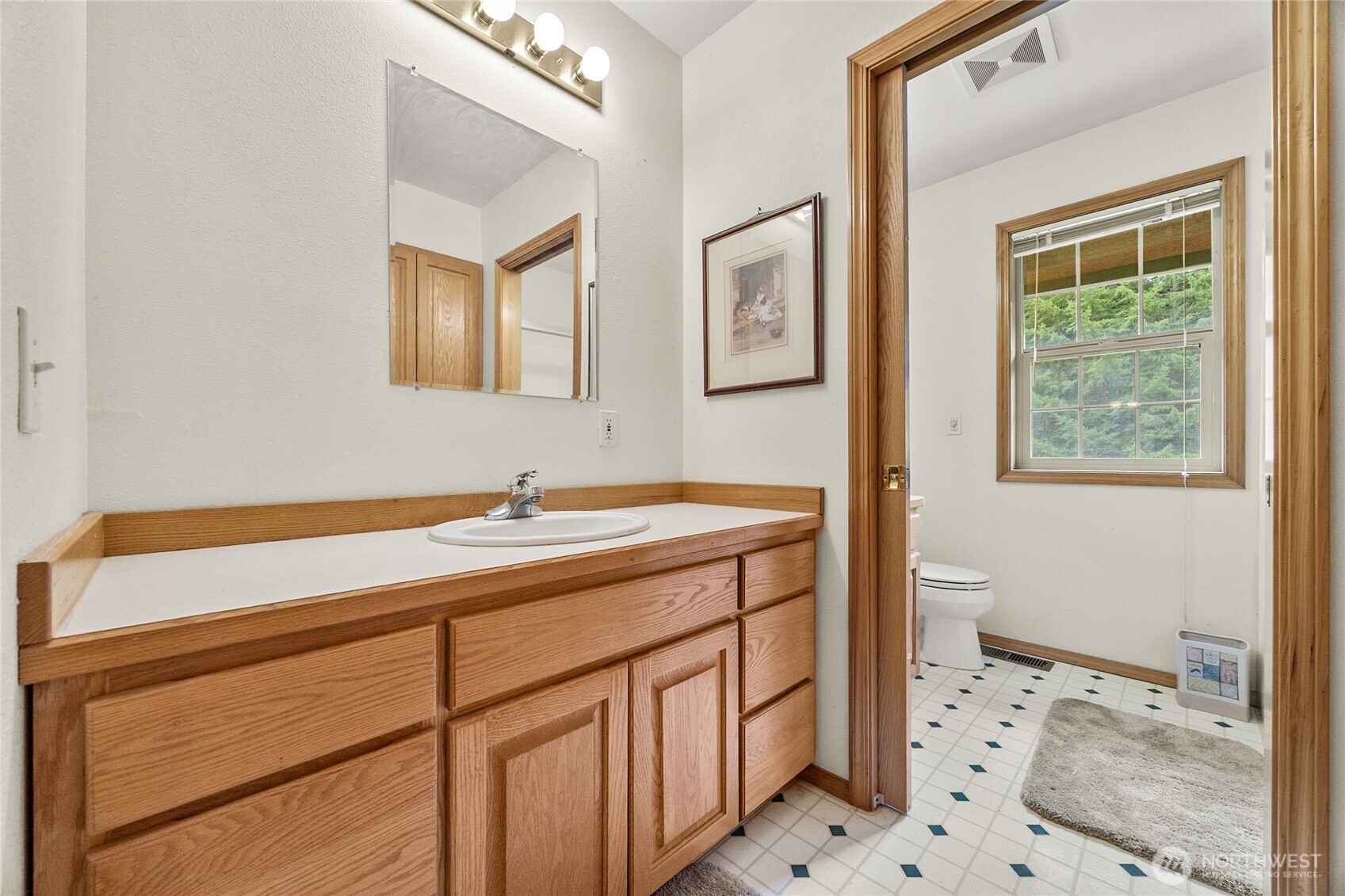 122 Ridge View Drive Randle, WA 98377 - Photo 25 of 40 a bathroom with a sink a mirror and a shower