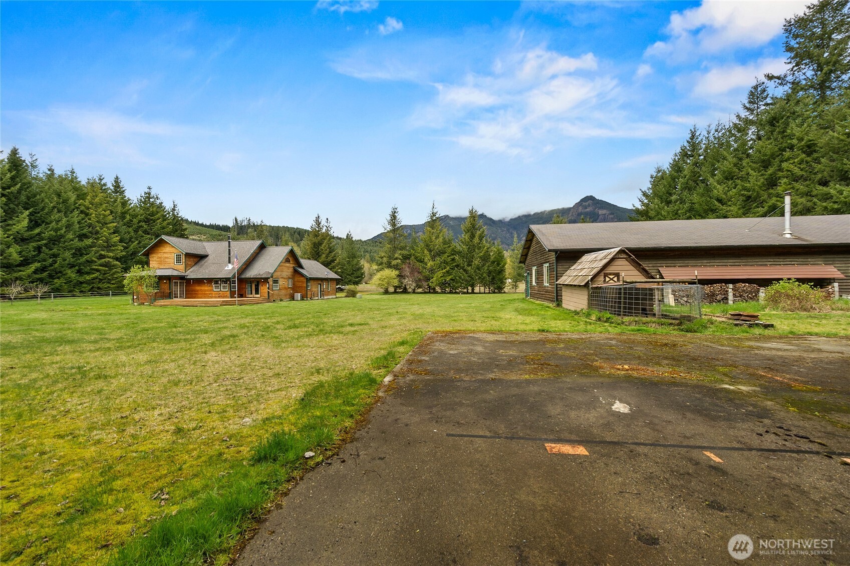 122 Ridge View Drive Randle, WA 98377 - Photo 32 of 40 a view of a house with a yard and sitting area