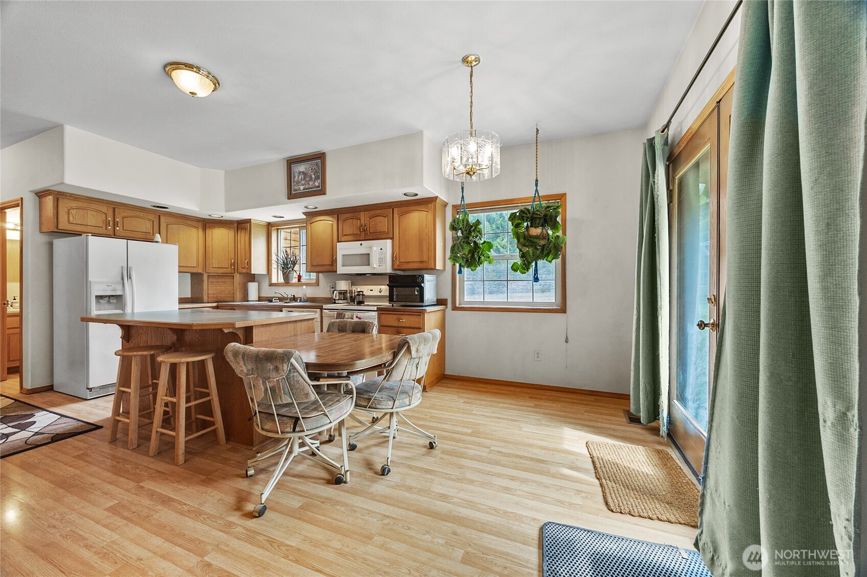 122 Ridge View Drive Randle, WA 98377 - Photo 8 of 40 a view of a dining room with furniture window and wooden floor