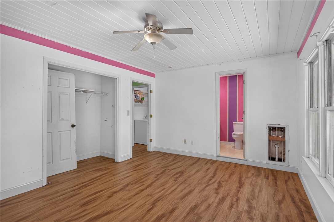 123 Robin Road Westminster, SC 29693 - Photo 41 of 50 Laminate wood flooring grounds this naturally illuminated room, complete with a ceiling fan for optimal comfort.