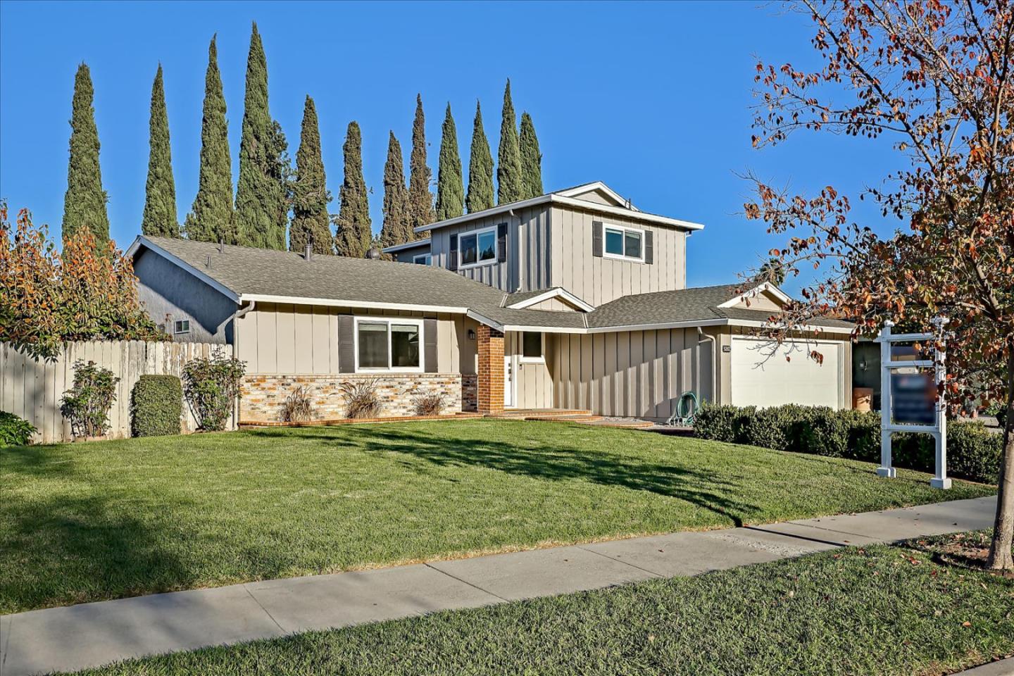 5282 Pebbletree Way San Jose, CA 95111 - Photo 2 of 39 a front view of a house with a yard