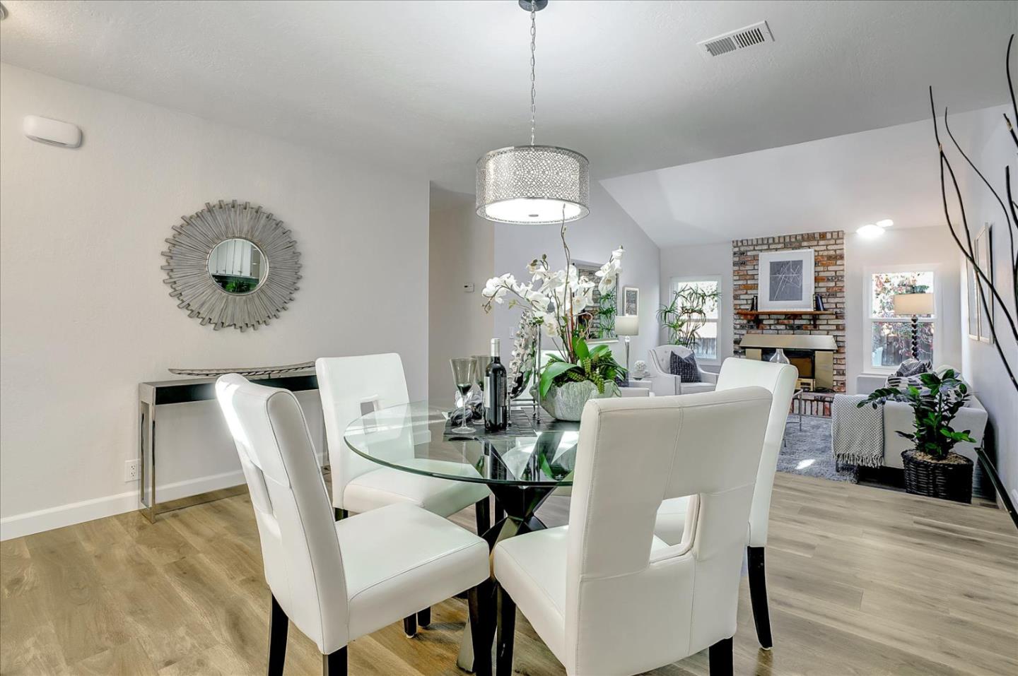 5282 Pebbletree Way San Jose, CA 95111 - Photo 12 of 39 a dining room with furniture potted plants and wooden floor