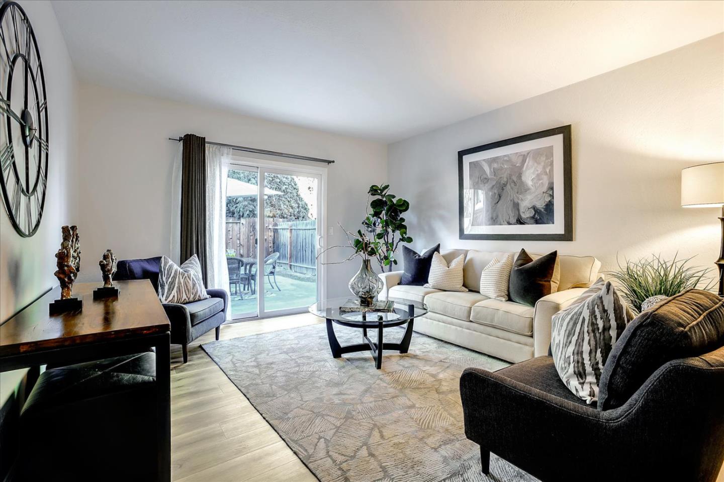 5282 Pebbletree Way San Jose, CA 95111 - Photo 18 of 39 a living room with furniture and a large window