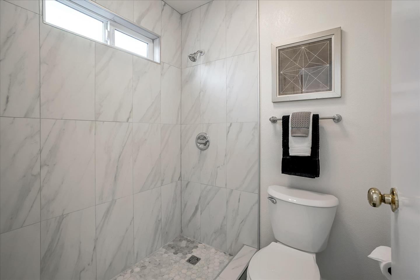 5282 Pebbletree Way San Jose, CA 95111 - Photo 26 of 39 a bathroom with a toilet and a shower