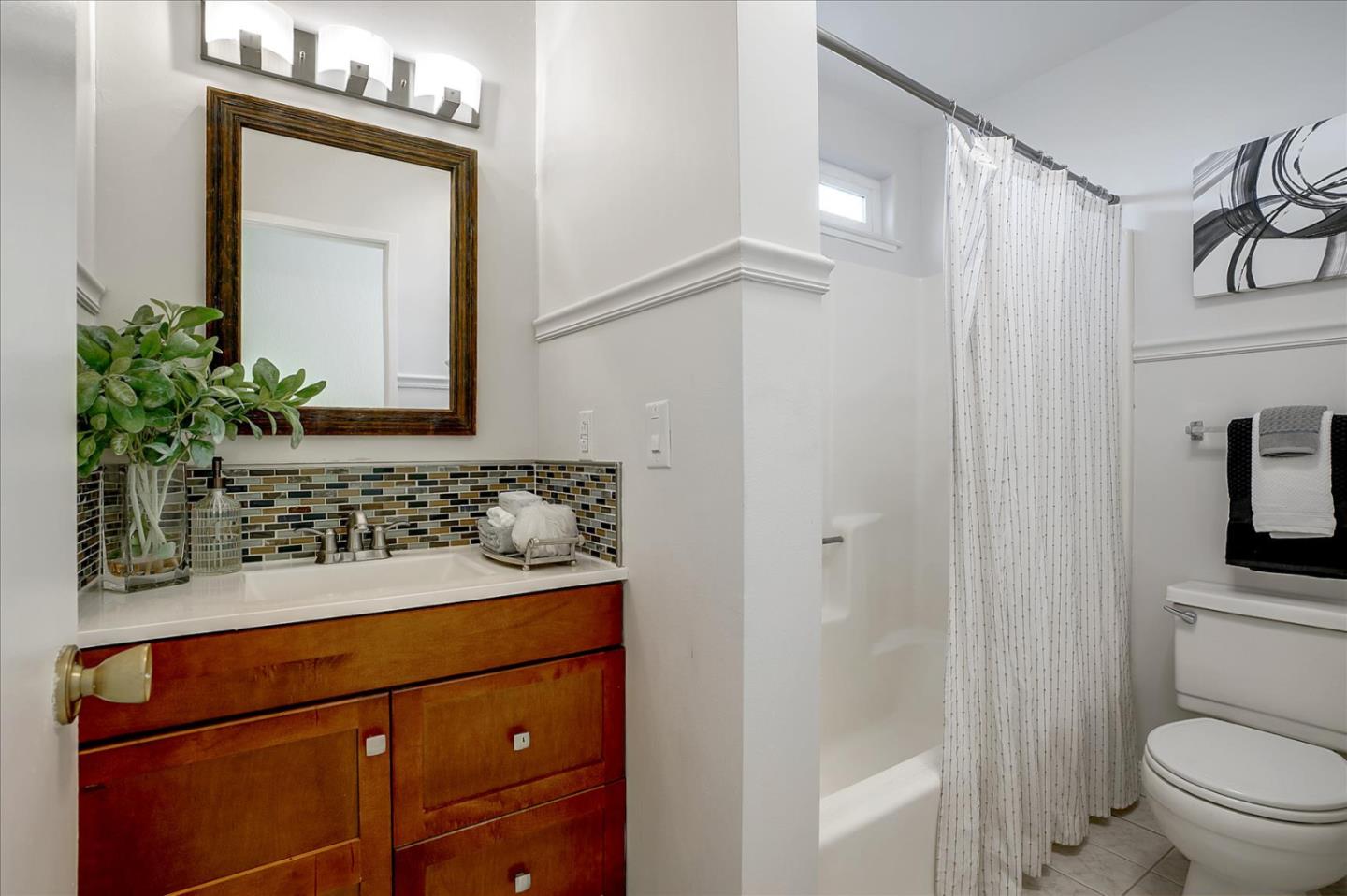 5282 Pebbletree Way San Jose, CA 95111 - Photo 37 of 39 a bathroom with a sink vanity mirror and toilet