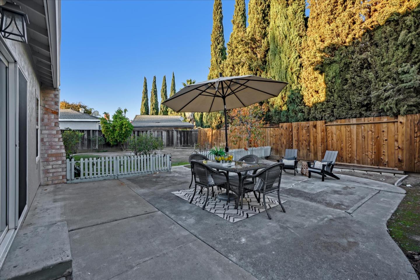 5282 Pebbletree Way San Jose, CA 95111 - Photo 39 of 39 a view of a sitting area with furniture and umbrella