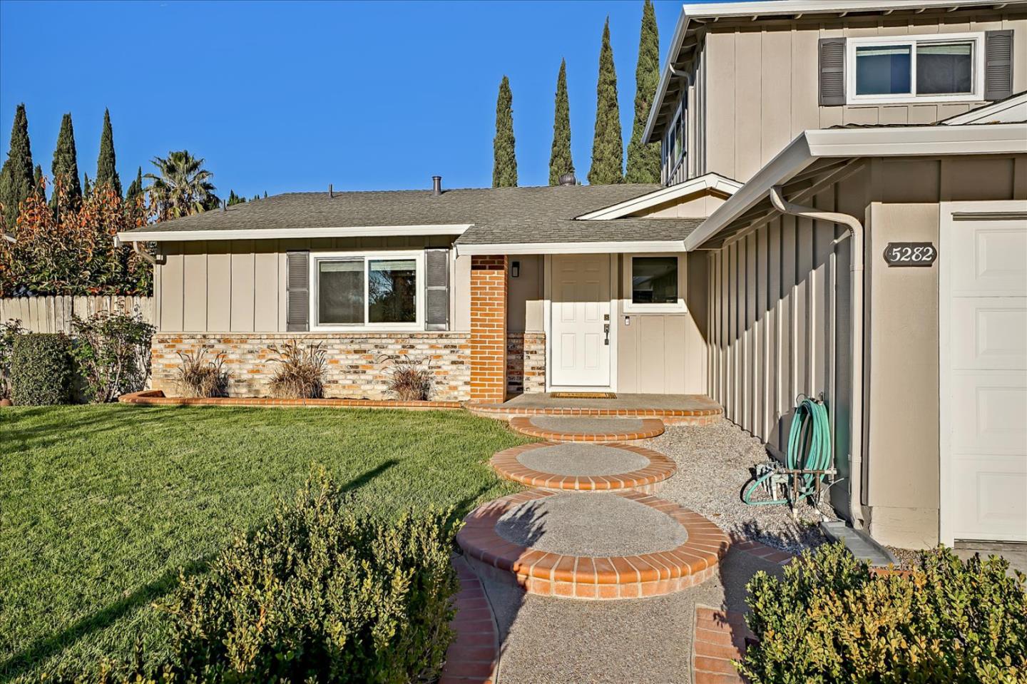 5282 Pebbletree Way San Jose, CA 95111 - Photo 5 of 39 a front view of a house with a yard