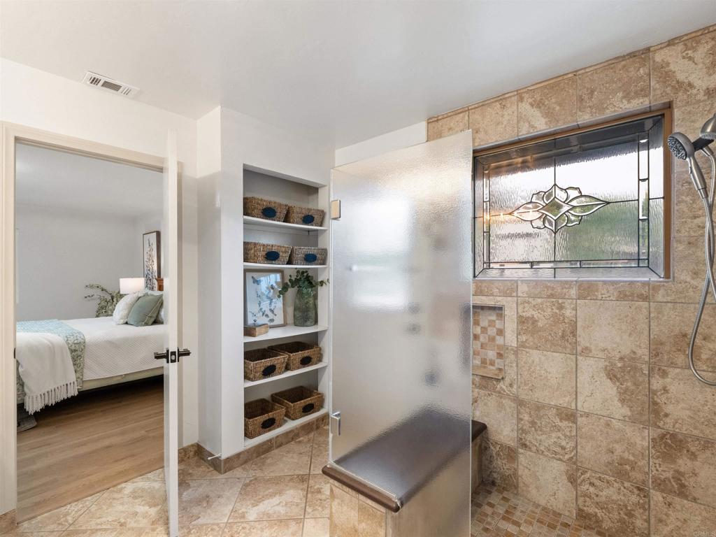 13737 Temple Street Poway, CA 92064 - Photo 20 of 38 a bedroom with a bed and a window