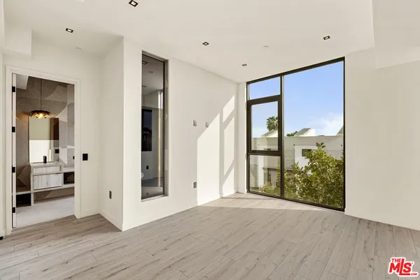 a living room with a table and chairs