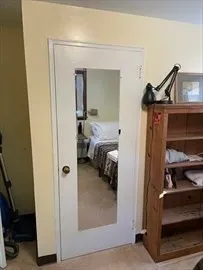 a view of hallway with livingroom and furniture