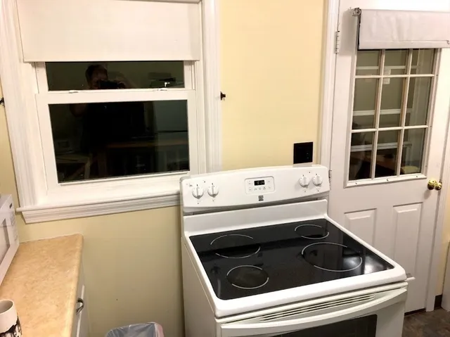 a bathroom with a sink and a microwave