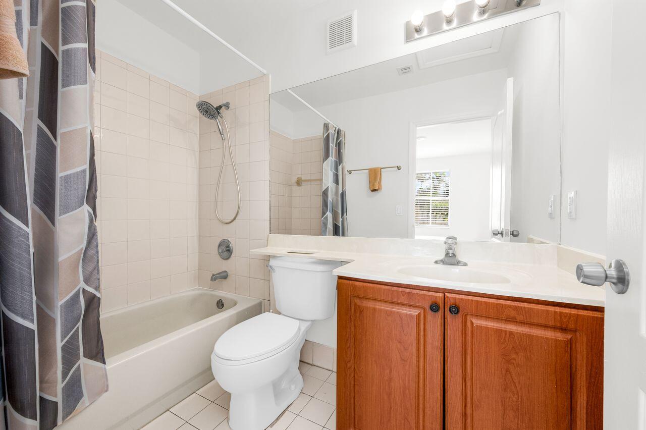 3169 Southwest 129th Terrace, Unit 164 Miramar, FL 33027 - Photo 13 of 20 a bathroom with a sink toilet and shower