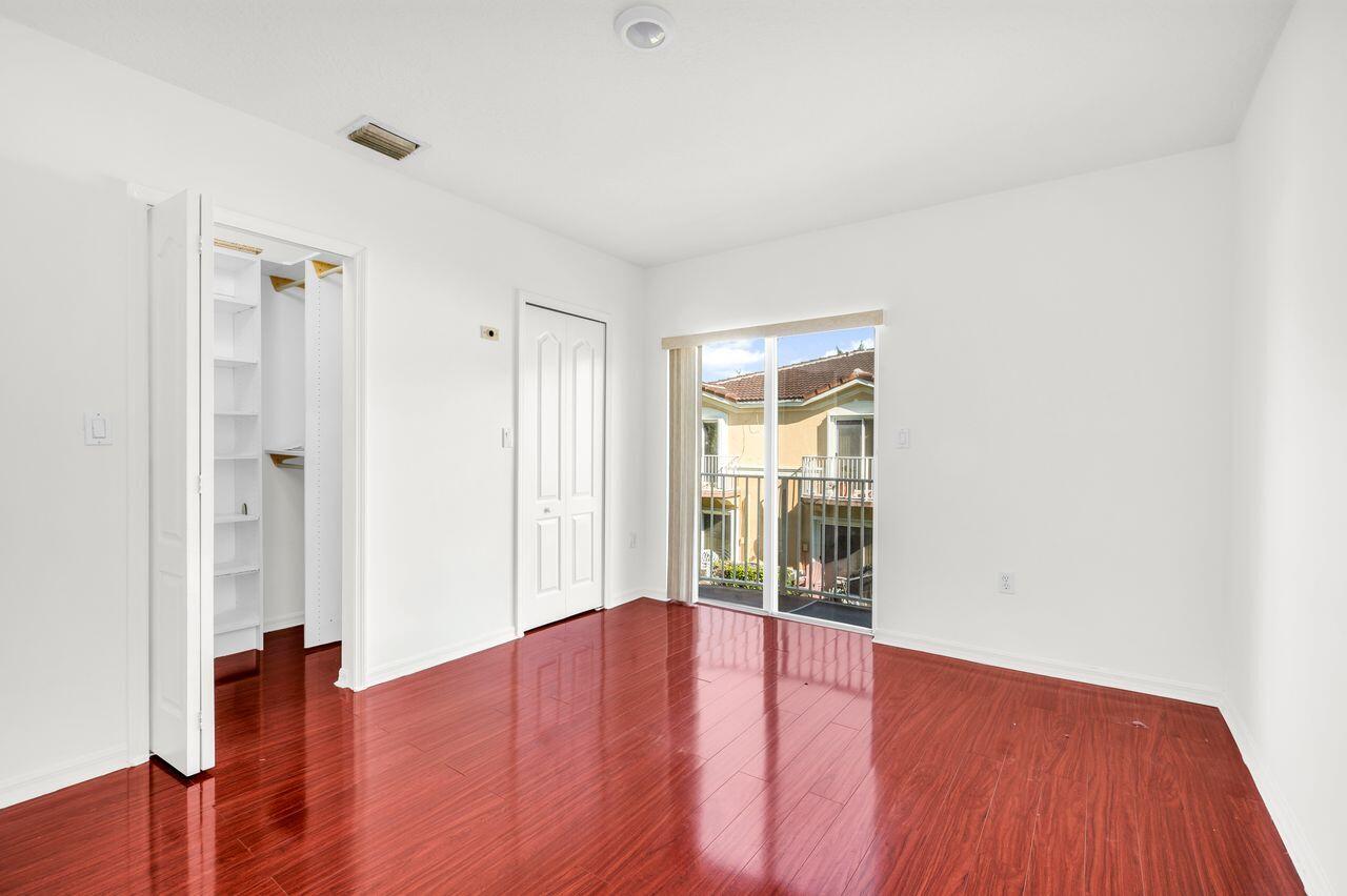 3169 Southwest 129th Terrace, Unit 164 Miramar, FL 33027 - Photo 14 of 20 wooden floor in an empty room