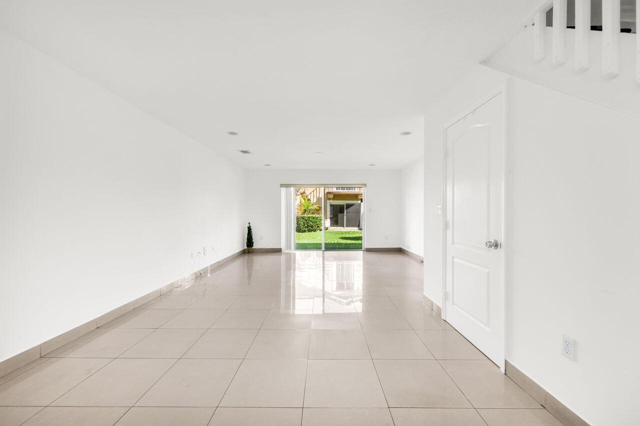 3169 Southwest 129th Terrace, Unit 164 Miramar, FL 33027 - Photo 10 of 20 a view of an empty room with a window