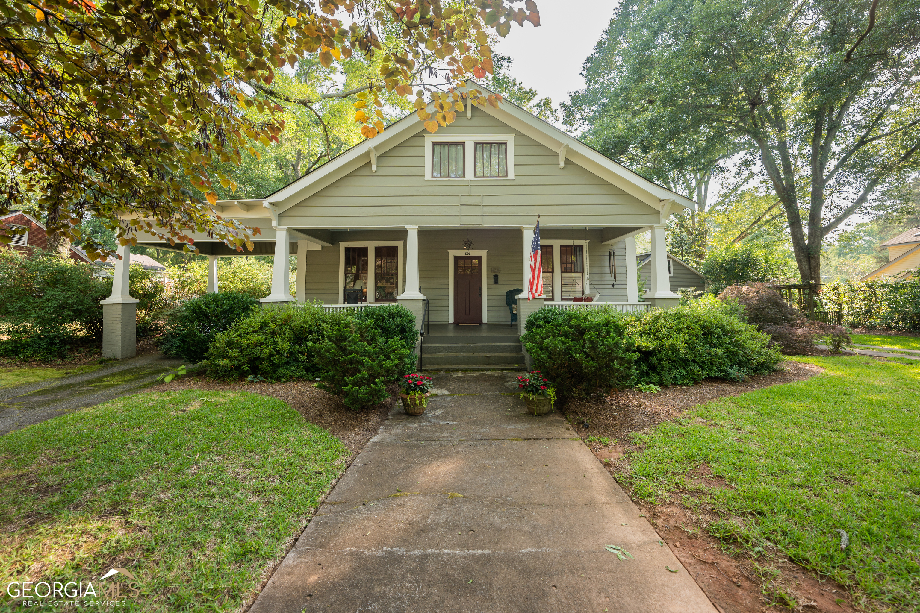 696 Billups Avenue Madison, GA 30650 - Photo 1 of 1 a front view of a house with garden