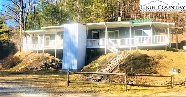 786 Teaberry Road Warrensville, NC 28693 - Photo 1 of 35 a front view of a house with a ocean view