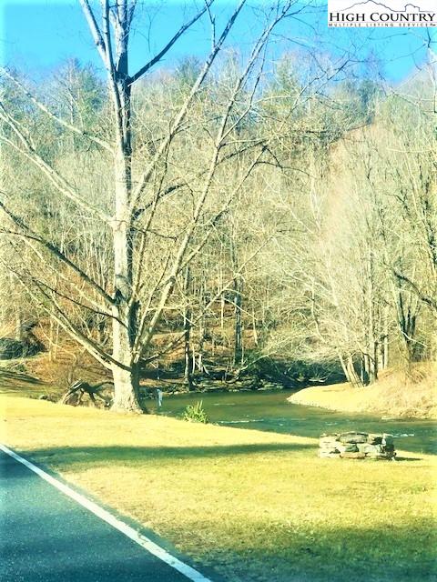 786 Teaberry Road Warrensville, NC 28693 - Photo 35 of 35 a view of an ocean and a yard