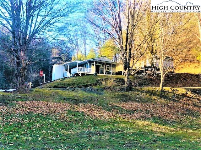 786 Teaberry Road Warrensville, NC 28693 - Photo 6 of 35 a front view of a house with a yard