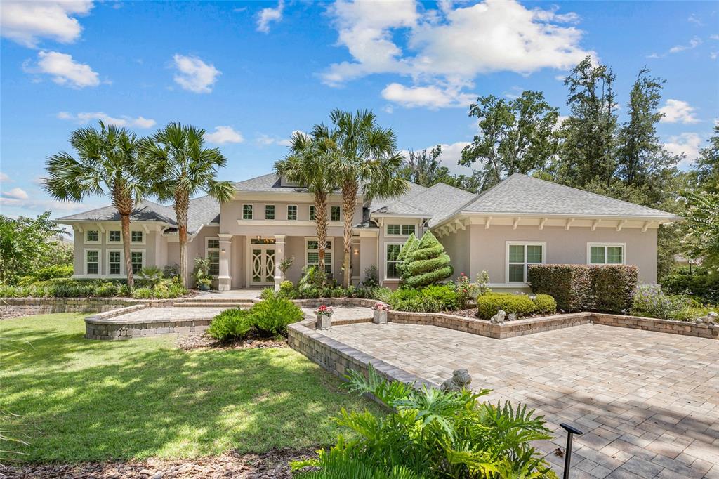 11372 Southwest 30th Avenue Gainesville, FL 32608 - Photo 1 of 71 a front view of a house with a yard and potted plants