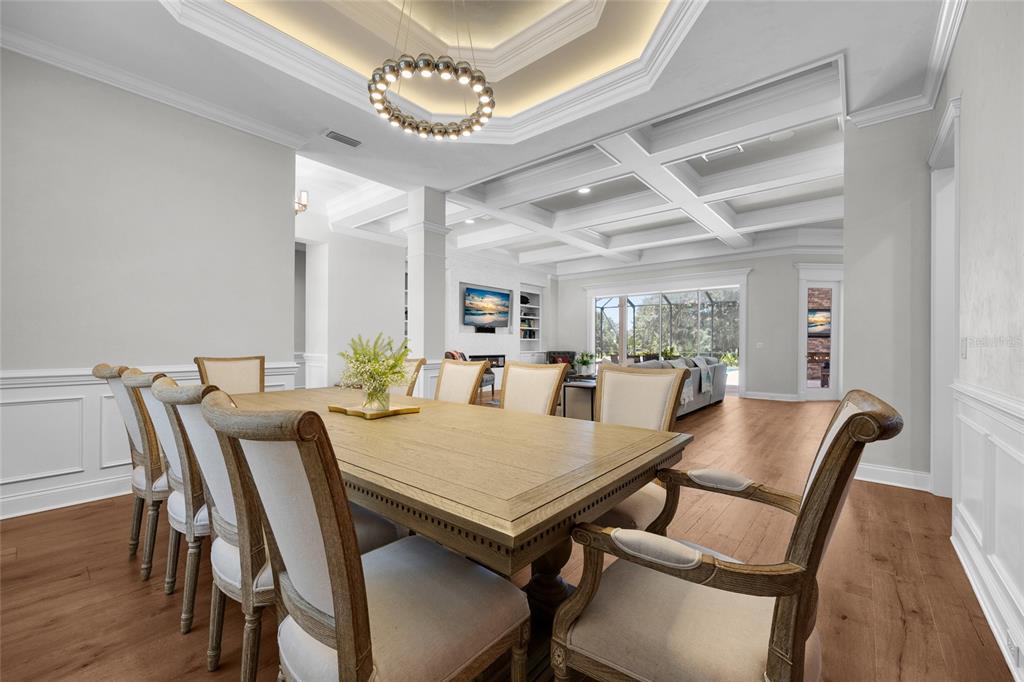 11372 Southwest 30th Avenue Gainesville, FL 32608 - Photo 13 of 71 a view of a dining room with furniture and wooden floor