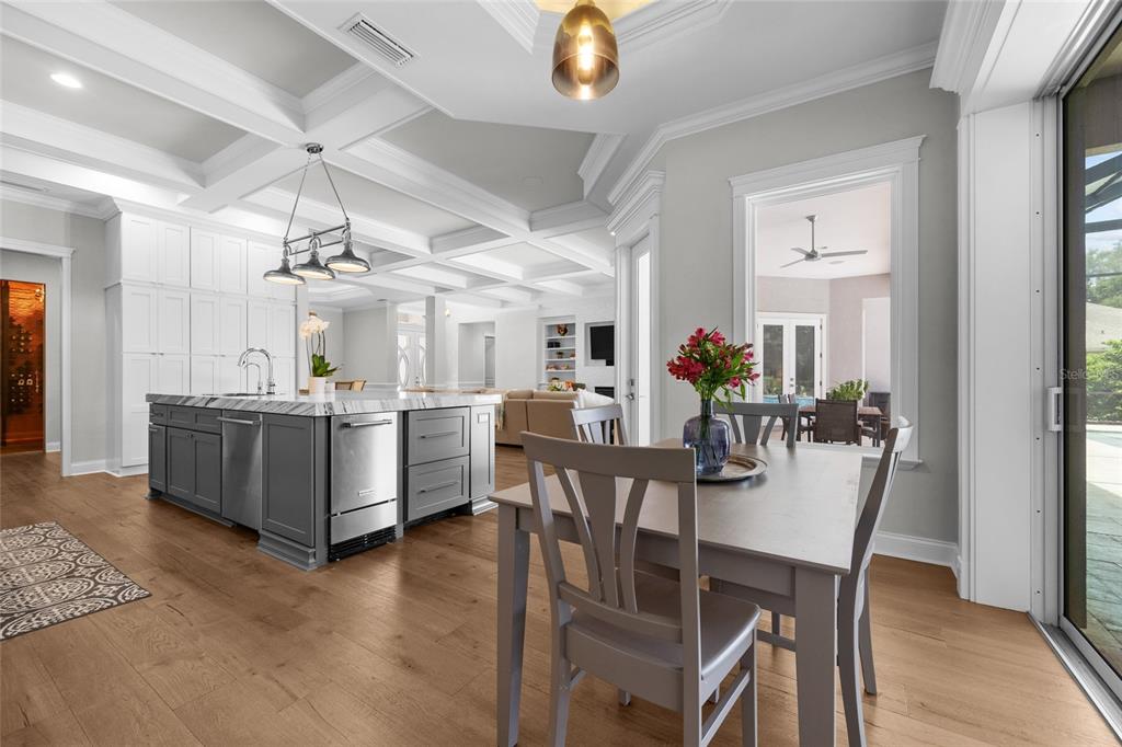 11372 Southwest 30th Avenue Gainesville, FL 32608 - Photo 16 of 71 a view of a dining room with furniture and a chandelier