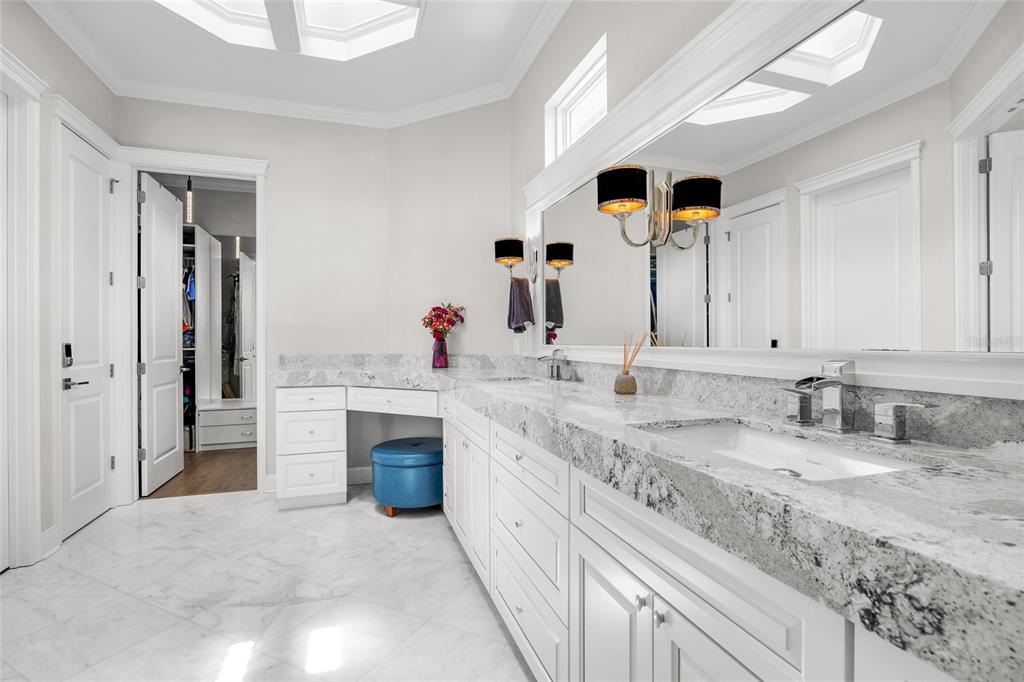 11372 Southwest 30th Avenue Gainesville, FL 32608 - Photo 24 of 71 a spacious bathroom with a sink double vanity and a mirror