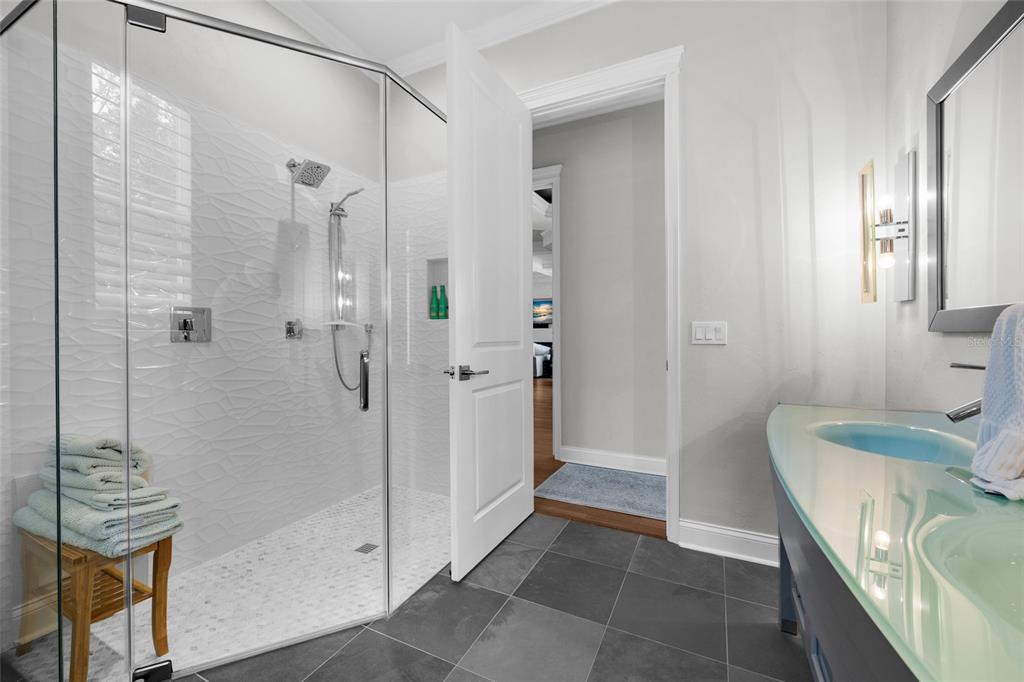 11372 Southwest 30th Avenue Gainesville, FL 32608 - Photo 31 of 71 a bathroom with a sink a toilet and shower