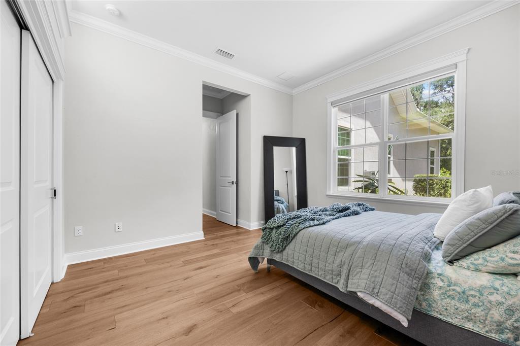11372 Southwest 30th Avenue Gainesville, FL 32608 - Photo 33 of 71 a bedroom with a bed and a large window