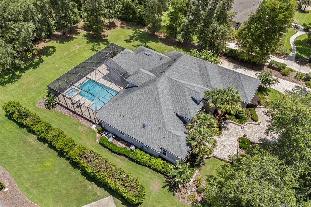 11372 Southwest 30th Avenue Gainesville, FL 32608 - Photo 61 of 71 an aerial view of a house with a garden and lake view