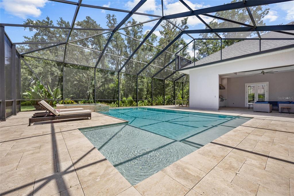 11372 Southwest 30th Avenue Gainesville, FL 32608 - Photo 8 of 71 a view of a patio with a table and chairs under an umbrella