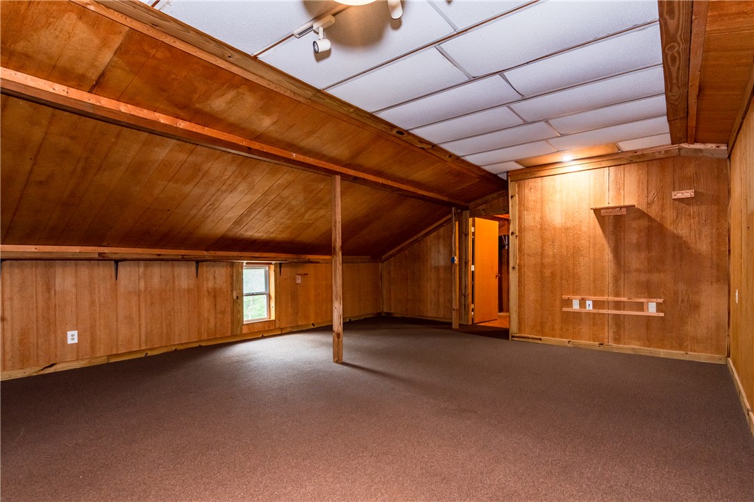 6750 Little Twin Road Germantown, OH 45327 - Photo 57 of 88 This spacious bonus room features wood paneling and ample natural light, offering versatile living space.