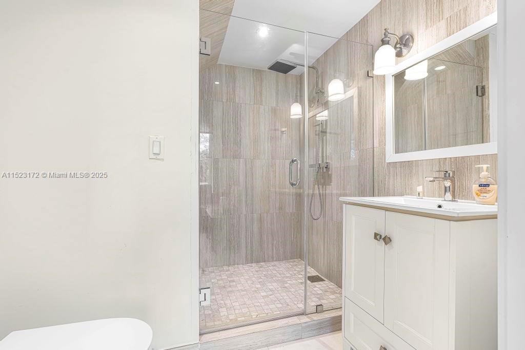 Coral Terrace Miami, FL 33155 - Photo 14 of 51 a bathroom with a sink a toilet and shower