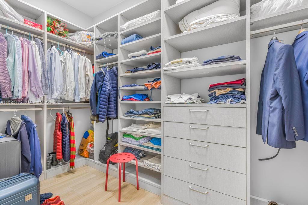 Coral Terrace Miami, FL 33155 - Photo 20 of 51 a view of walk in closet with clothes and shoes