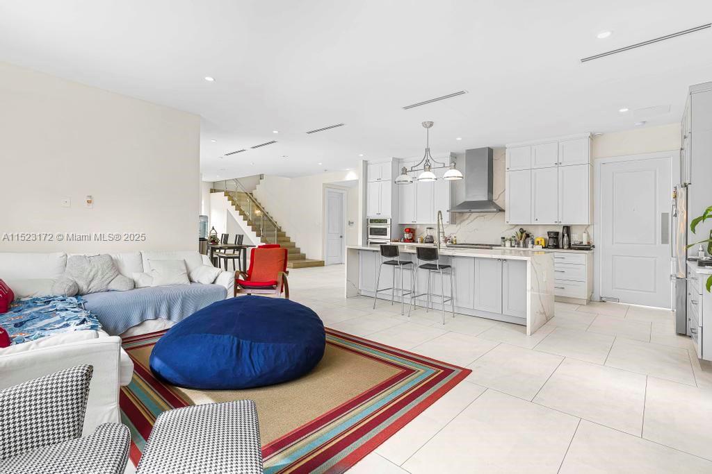 Coral Terrace Miami, FL 33155 - Photo 7 of 51 a living room filled with furniture and kitchen view