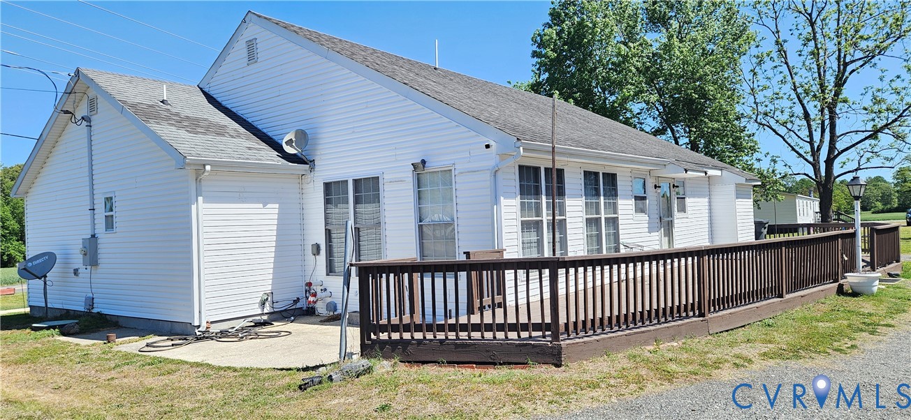1025 Sunnyside Road Tappahannock, VA 22560 - Photo 3 of 5 a view of a house with a small yard and wooden fence