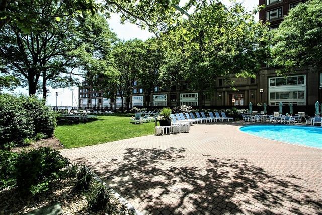 a view of a park with large trees