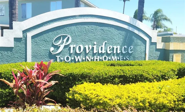 a sign that is on a brick wall