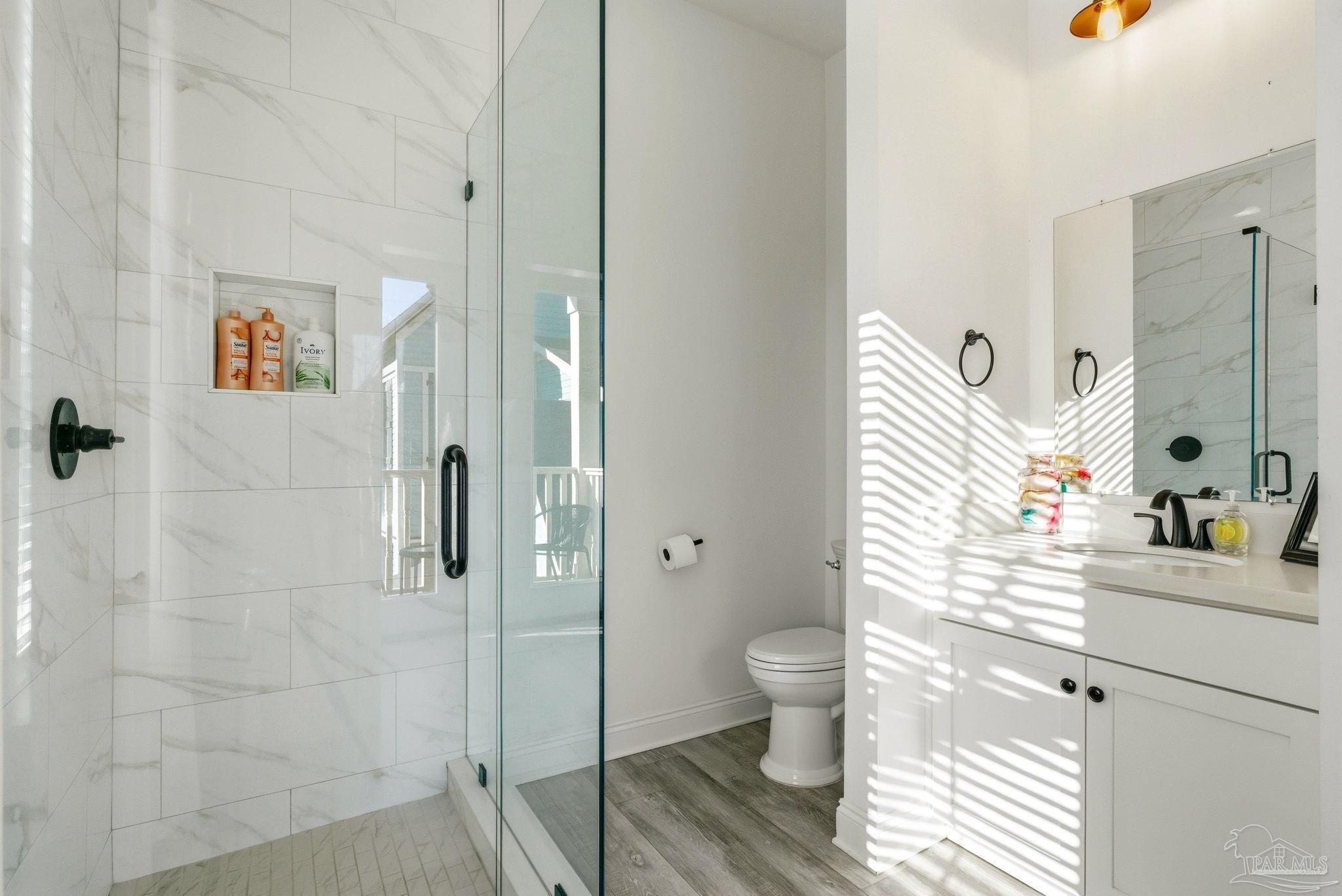 714 East La Rua Street Pensacola, FL 32501 - Photo 55 of 63 a bathroom with a sink a toilet and shower