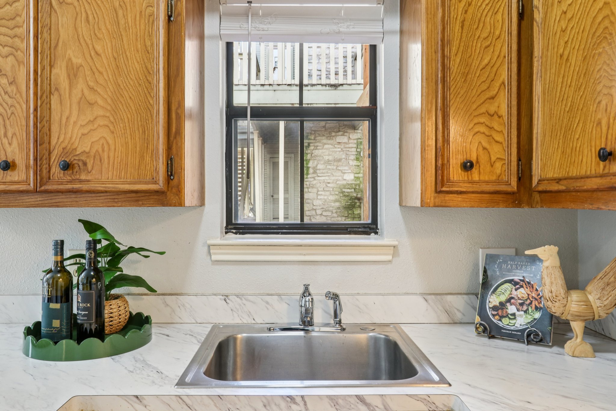 4401 Speedway, Unit 105 Austin, TX 78751 - Photo 25 of 38 The kitchen sink window brings in natural light and a peek at the beautiful stone exterior.