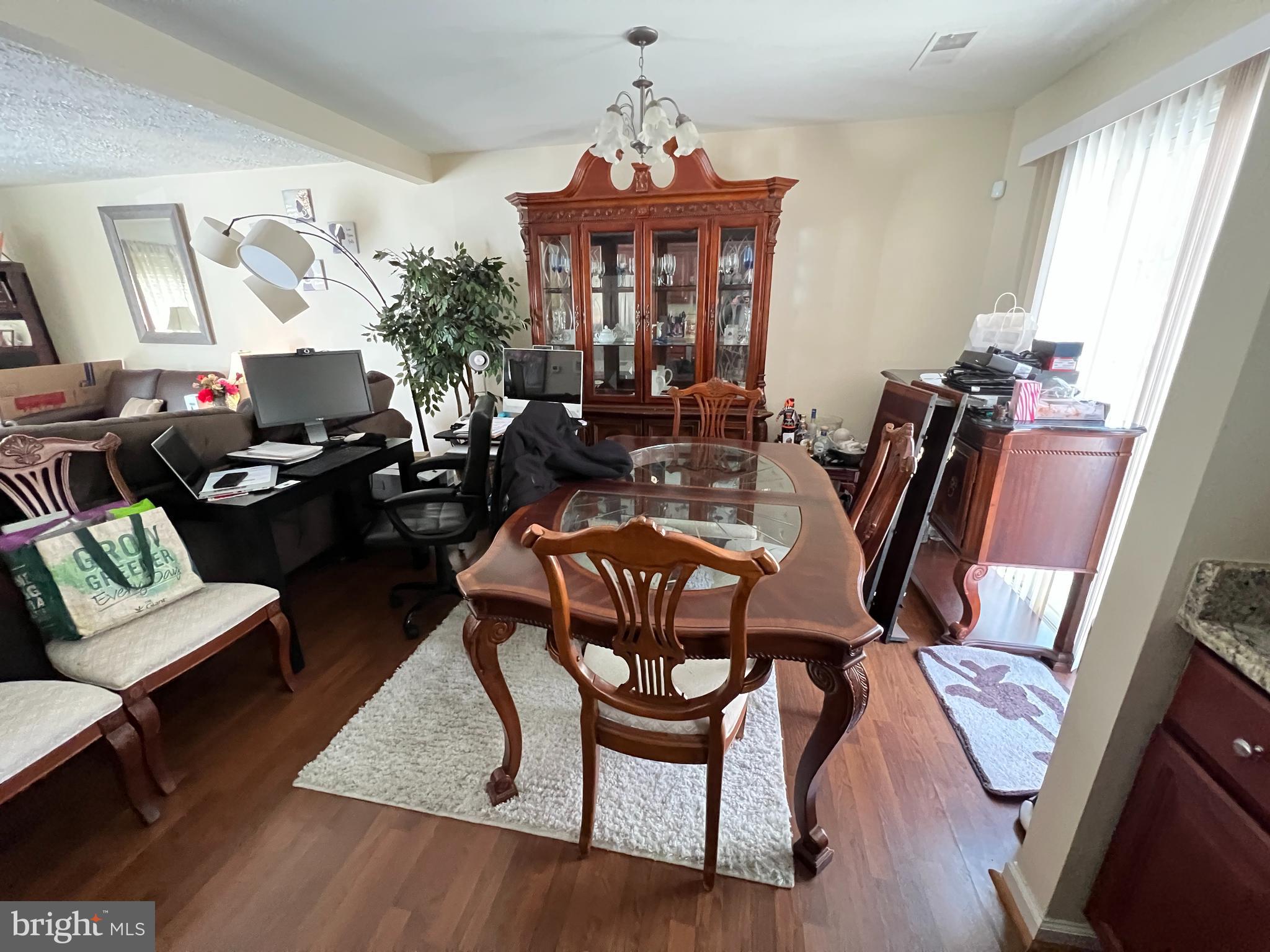 1915 Benning Road Northeast Washington, DC 20002 - Photo 20 of 22 a view of a dining room with furniture window and wooden floor