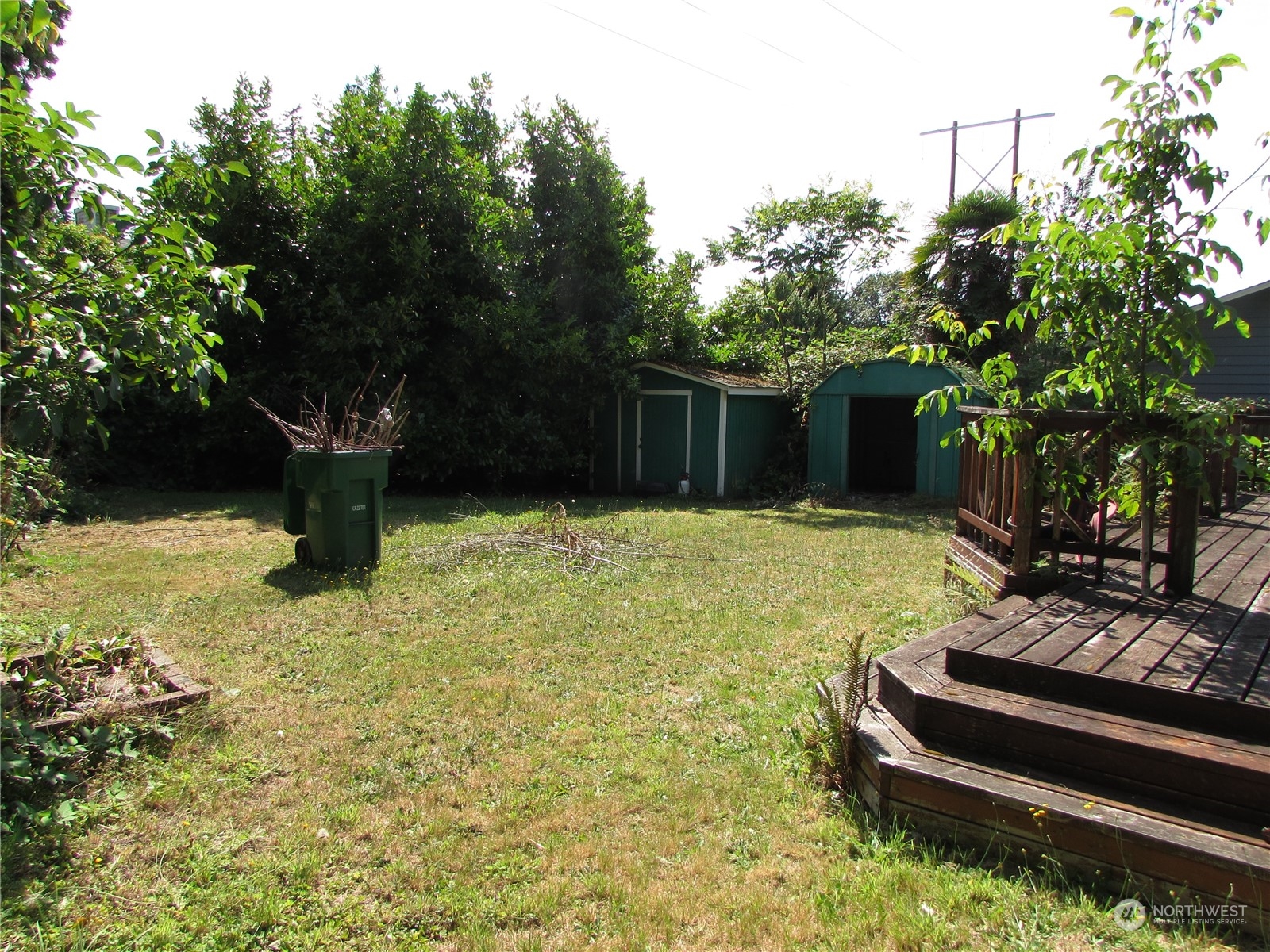 616 212th Street Southwest Bothell, WA 98021 - Photo 19 of 20 a view of a garden with a bench