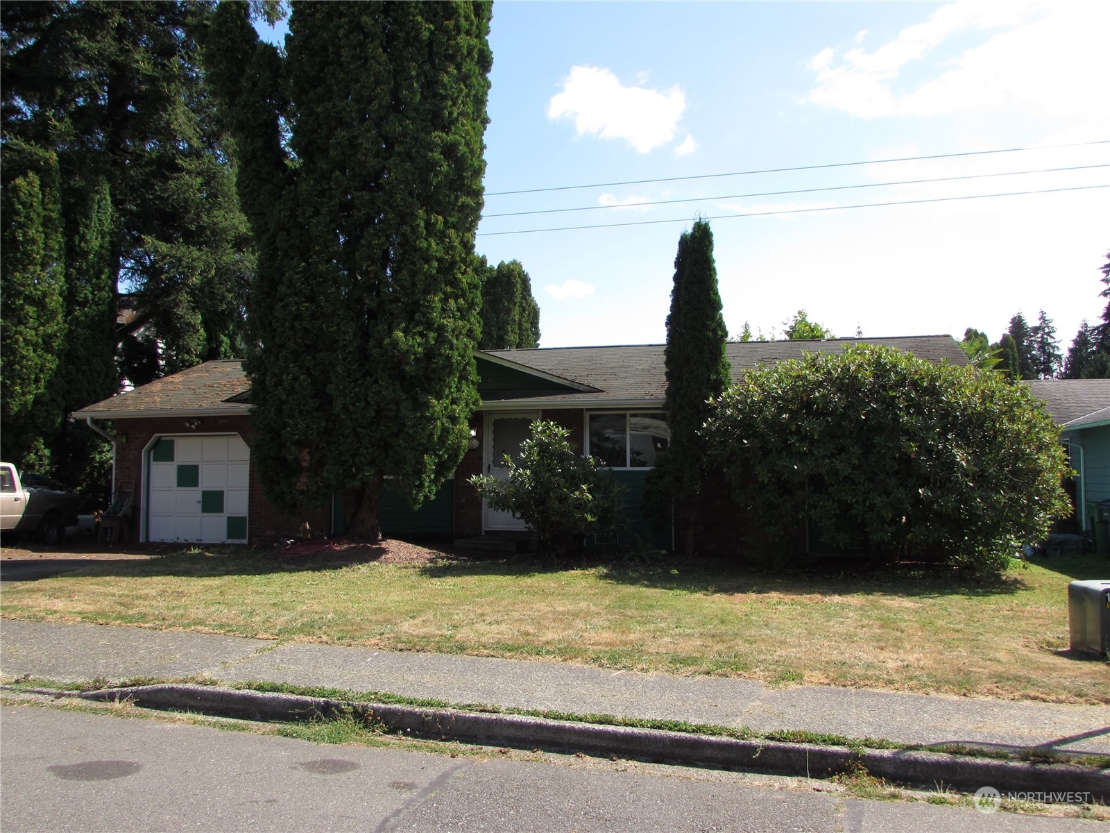 616 212th Street Southwest Bothell, WA 98021 - Photo 3 of 20 a front view of a house with a yard