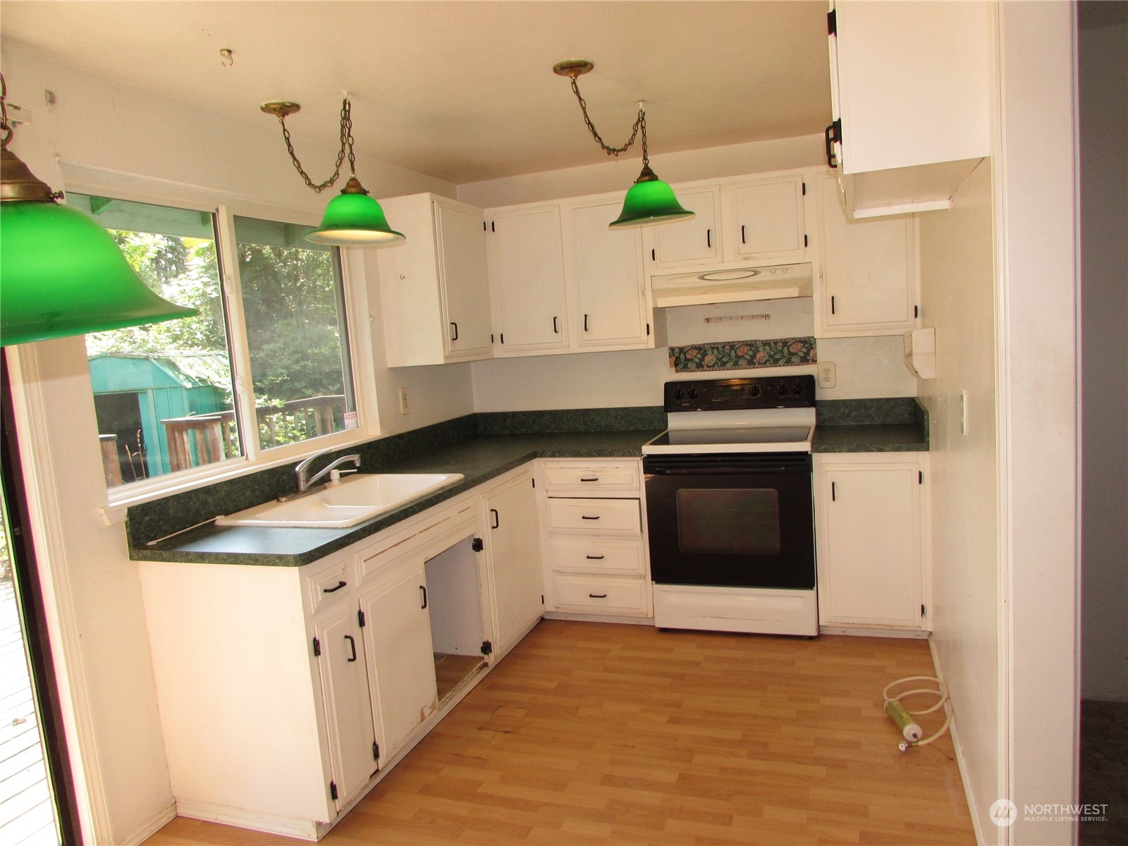 616 212th Street Southwest Bothell, WA 98021 - Photo 4 of 20 a kitchen with stainless steel appliances granite countertop a sink a stove and a refrigerator