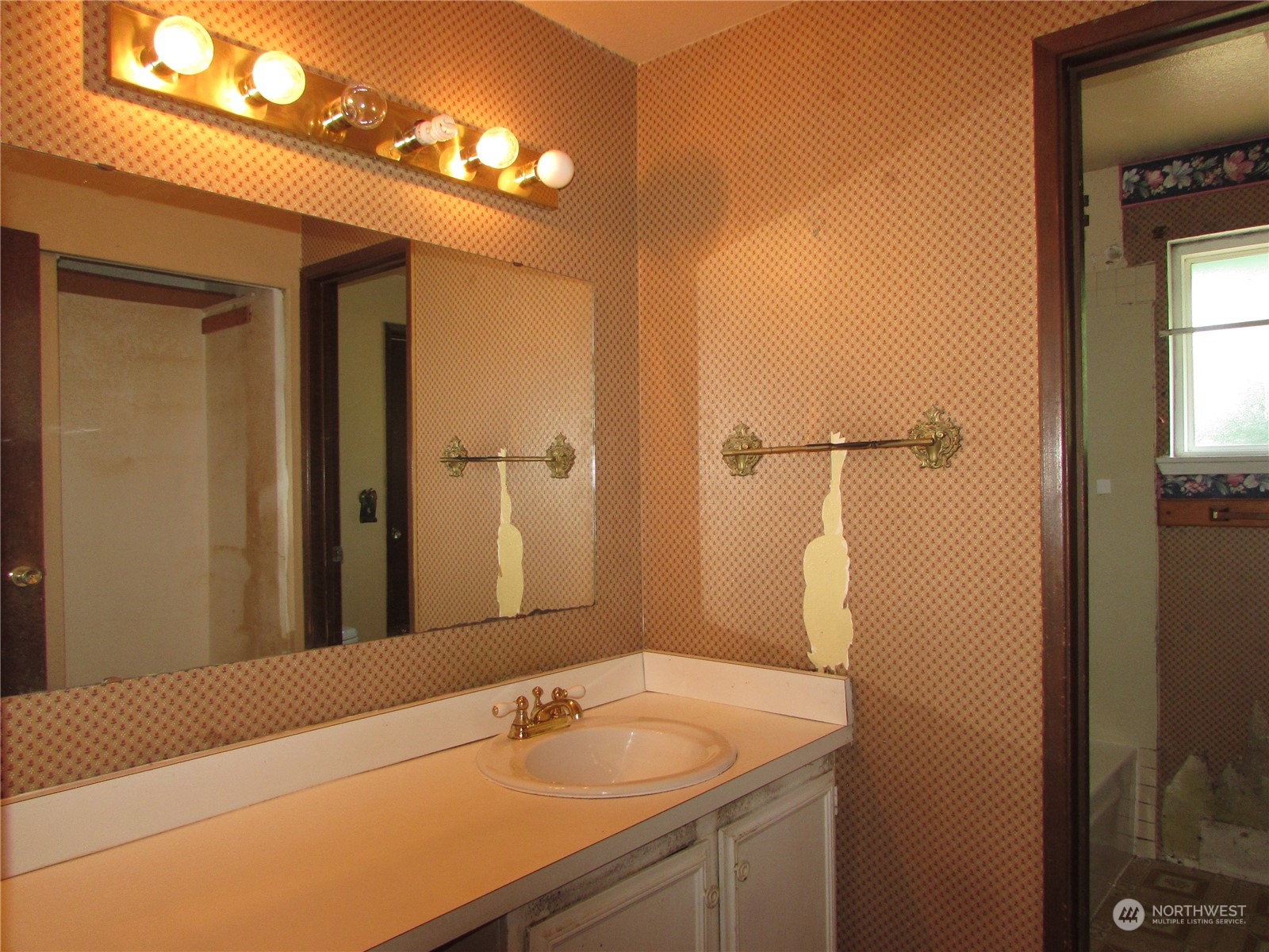 616 212th Street Southwest Bothell, WA 98021 - Photo 10 of 20 a bathroom with a sink and a mirror