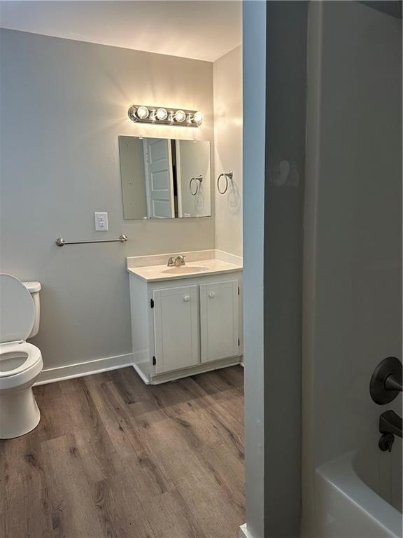 615 Cassville Road Southeast Cartersville, GA 30120 - Photo 21 of 24 a bathroom with a toilet sink and mirror