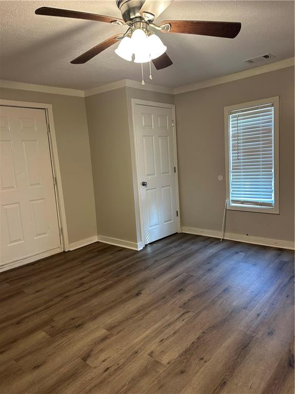 615 Cassville Road Southeast Cartersville, GA 30120 - Photo 24 of 24 a view of an empty room with wooden floor and a window