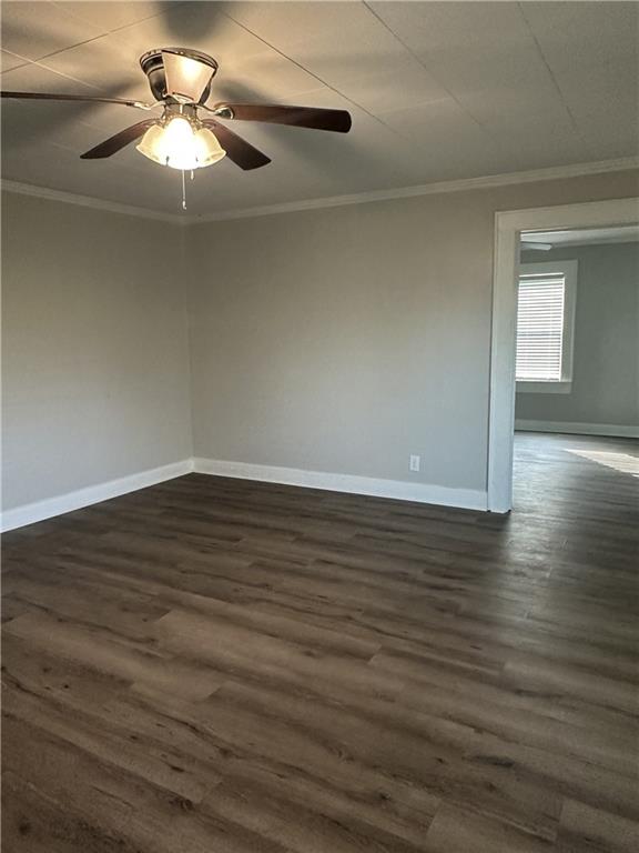615 Cassville Road Southeast Cartersville, GA 30120 - Photo 4 of 24 a view of a room with wooden floor and a ceiling fan