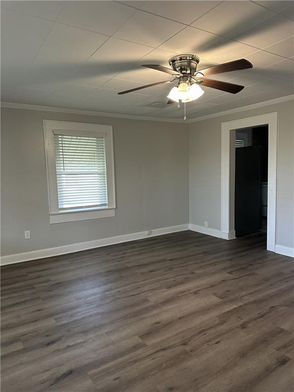 615 Cassville Road Southeast Cartersville, GA 30120 - Photo 5 of 24 a view of an empty room with wooden floor and a window