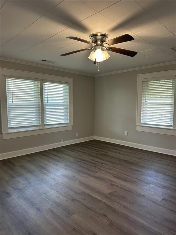 615 Cassville Road Southeast Cartersville, GA 30120 - Photo 6 of 24 a view of an empty room with wooden floor and a window