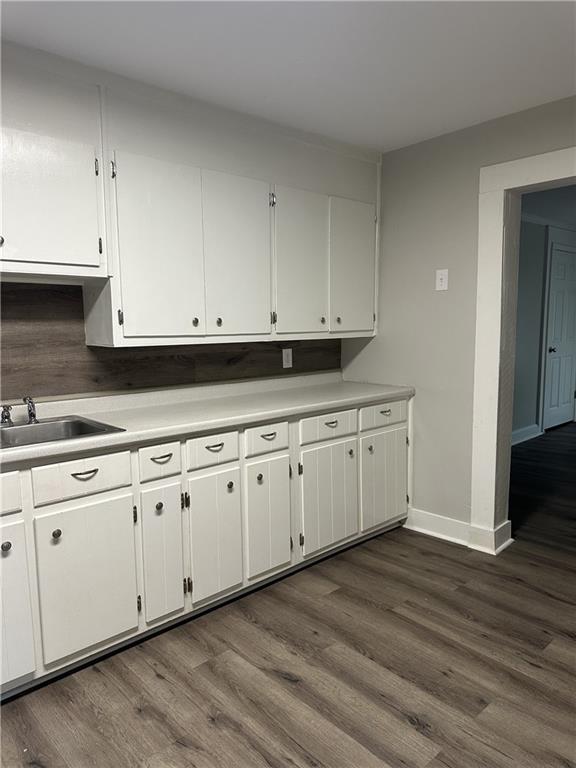 615 Cassville Road Southeast Cartersville, GA 30120 - Photo 8 of 24 a view of white cabinets and wooden floor